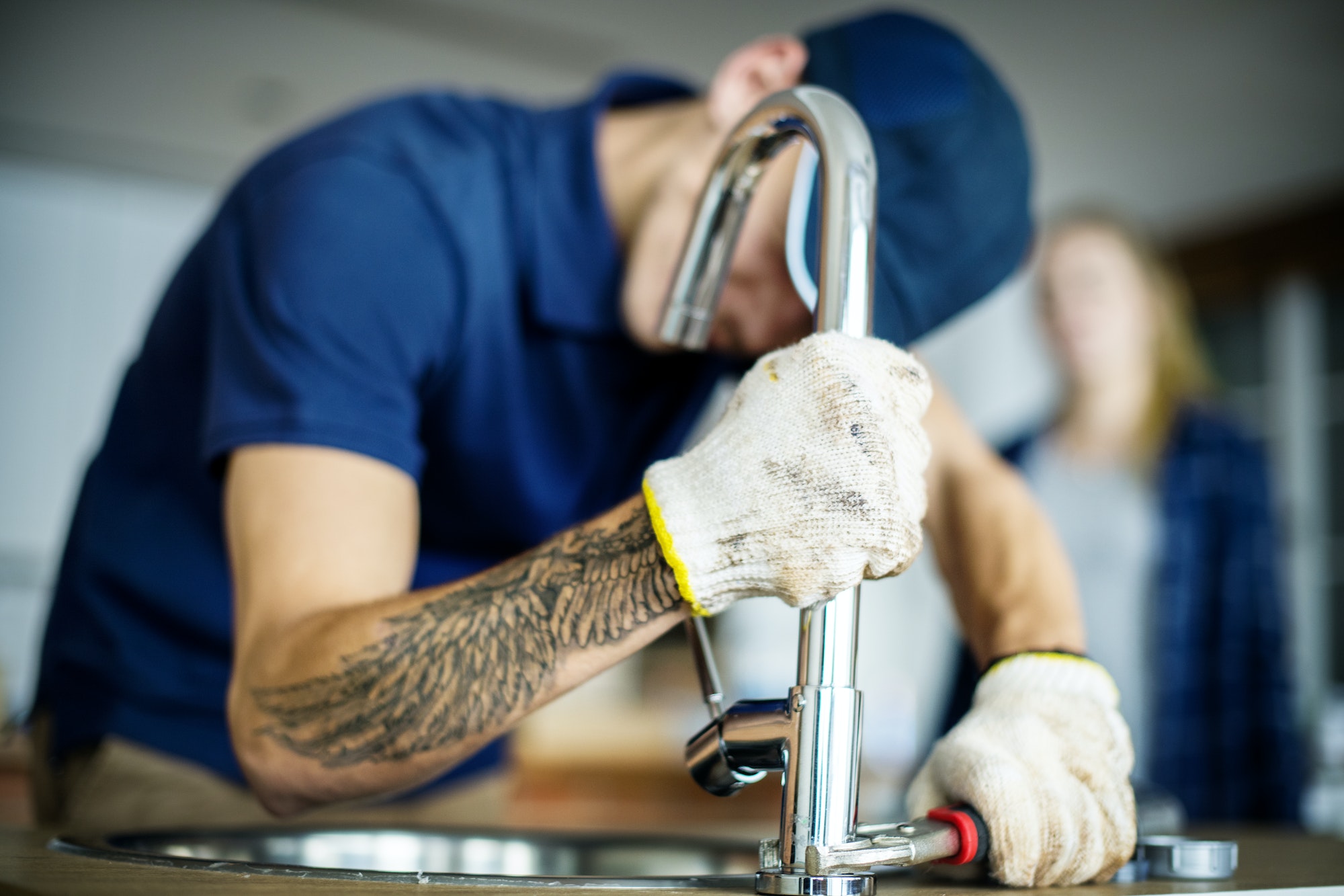 plumber-fixing-kitchen-sink.jpg